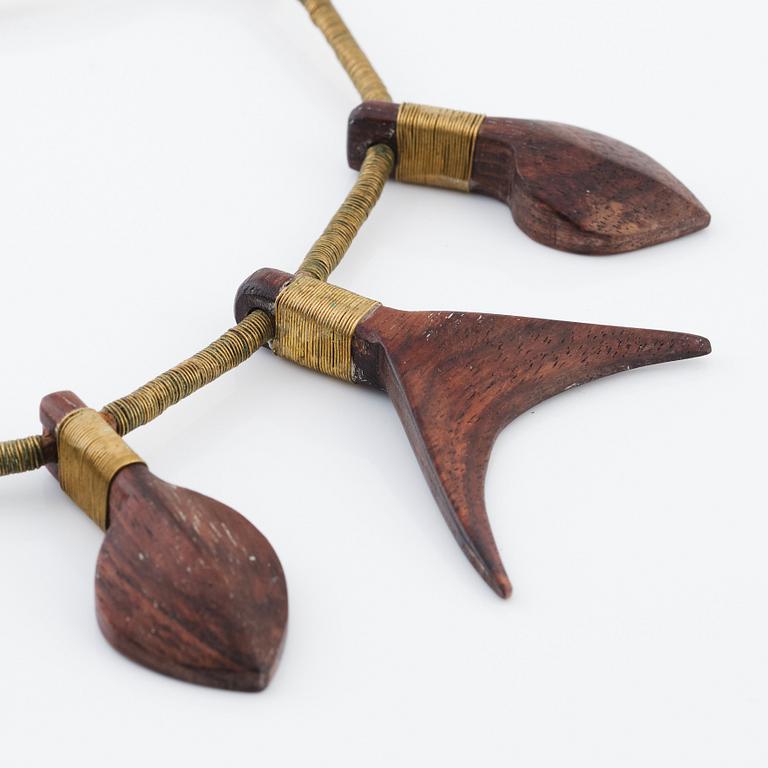 Vivianna Torun Bülow-Hübe, a leather necklace with brass and carved wooden details, most likely 1948-1949.