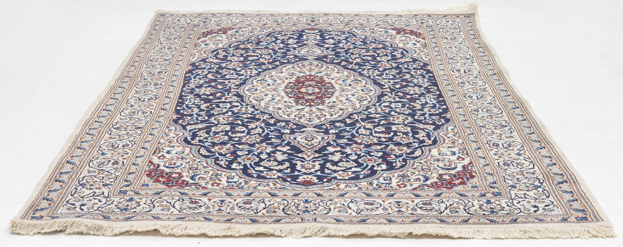 A Nain carpet, c. 295 x 190 cm.
