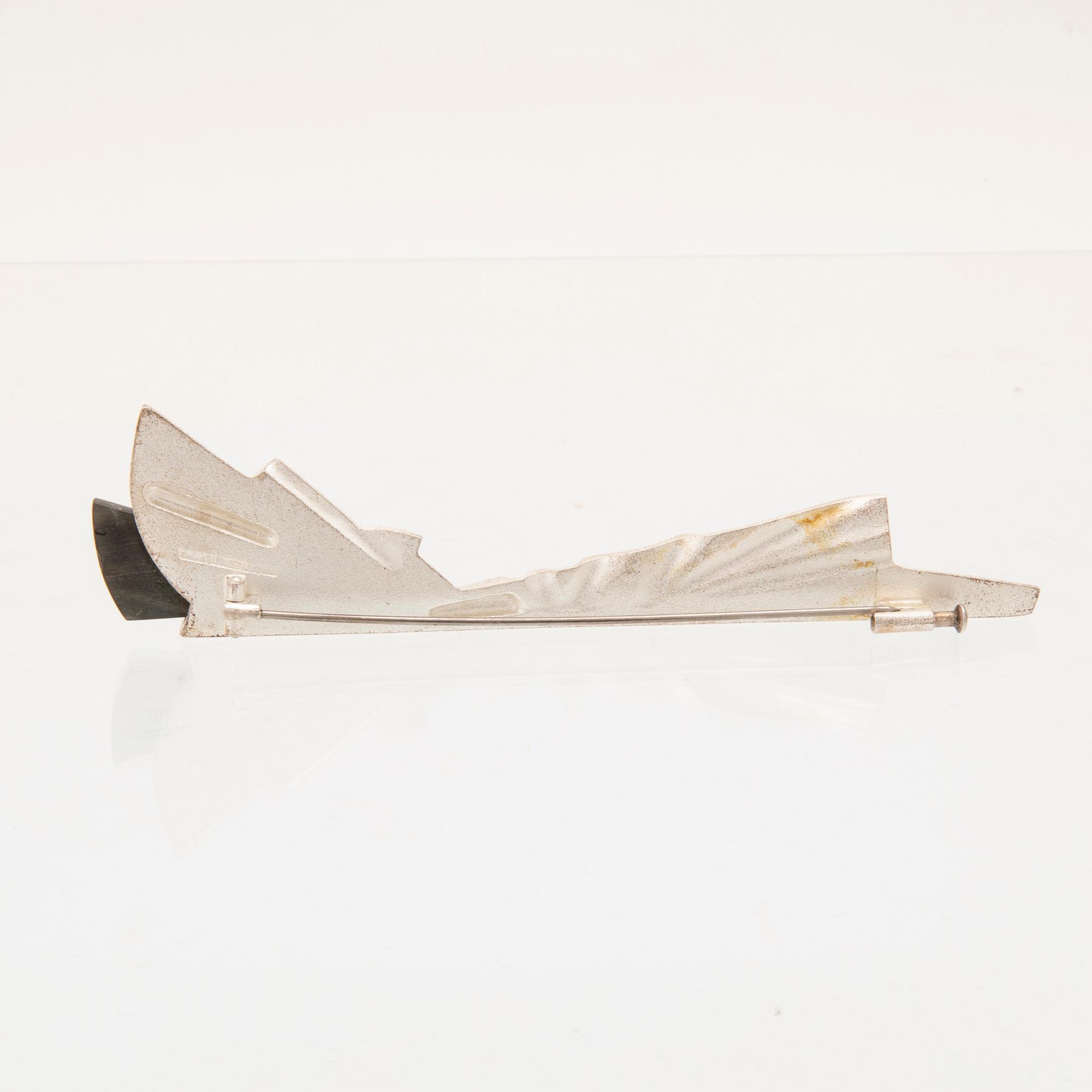 Zoltan Popovits, a "Railo" silver brooch set with spectrolite (variety of labradorite) for Lapponia 1991.
