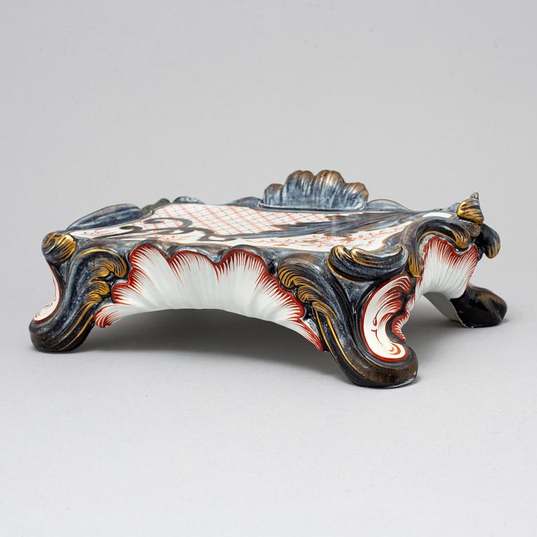 A new rococo creamware bracket clock, after Meissen model, early 20th century.