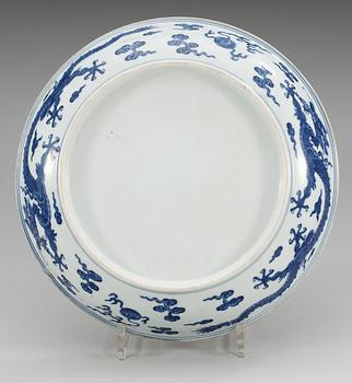 A blue and white ming style 'dragon' dish, Qing dynasty (1644-1912).
