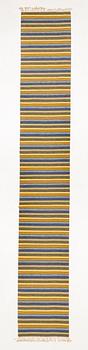 A flat weave runner, c. 580 x 90 cm.