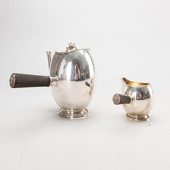 A Swedish 20th century silver coffee pot and creamer, mark of GAB Stockholm 1946 and 1948.