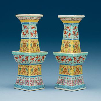 A pair of famille rose altarsticks, late Qing dynasty.