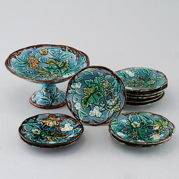 Eighteen majolica small plates and a serving dish from Rörstrand, second half of the 19th century.