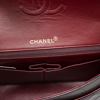 A "Double Flap bag" by Chanel.