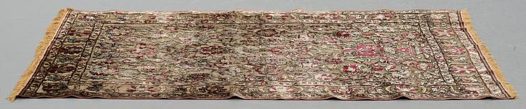 A rug, an antique silk metal brocaded Kashan, probably around 1910, ca 200-202,5 x 129-131 cm.