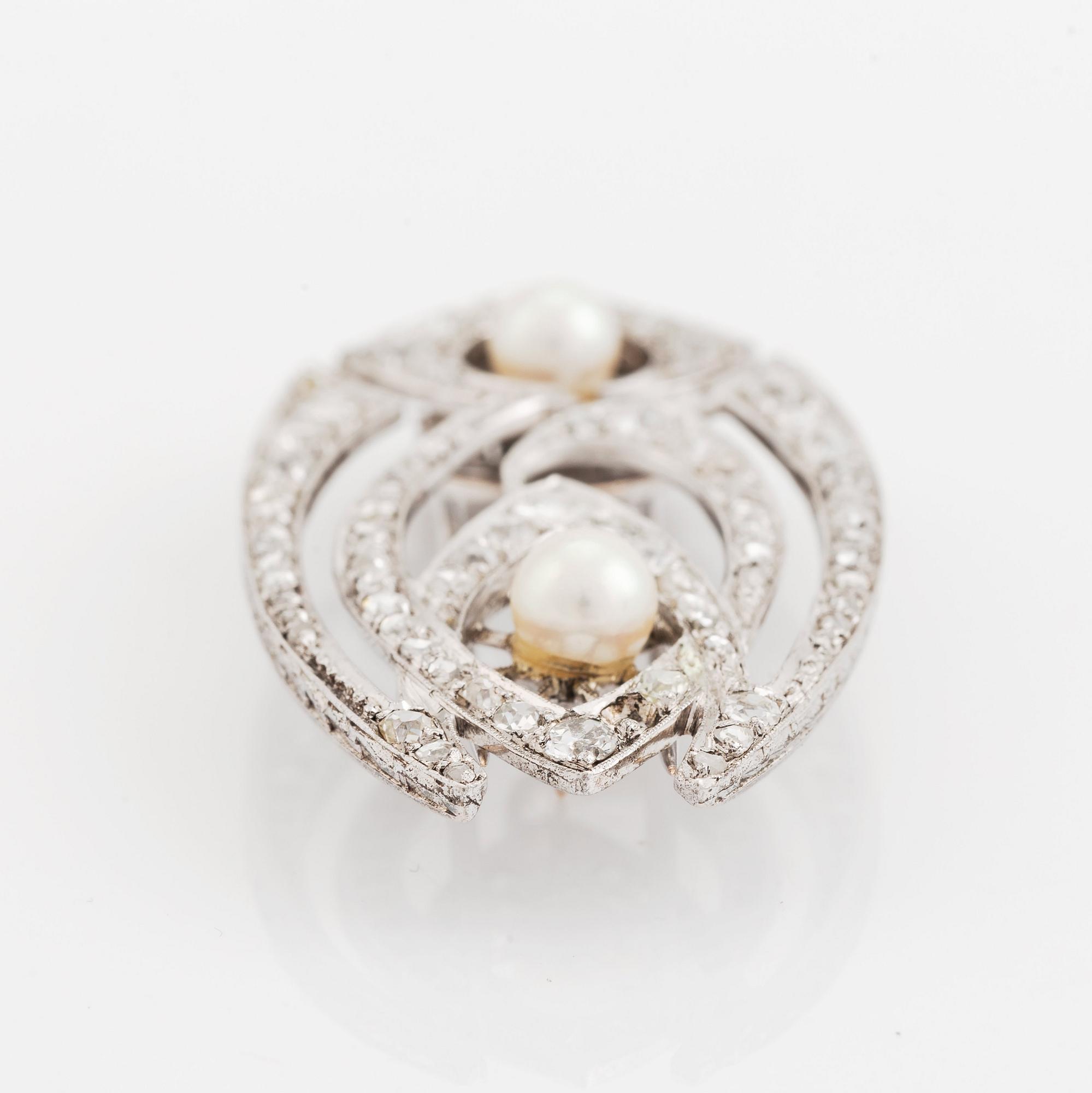 An 8K gold  brooch set with old- and rose-cut diamonds and pearls.