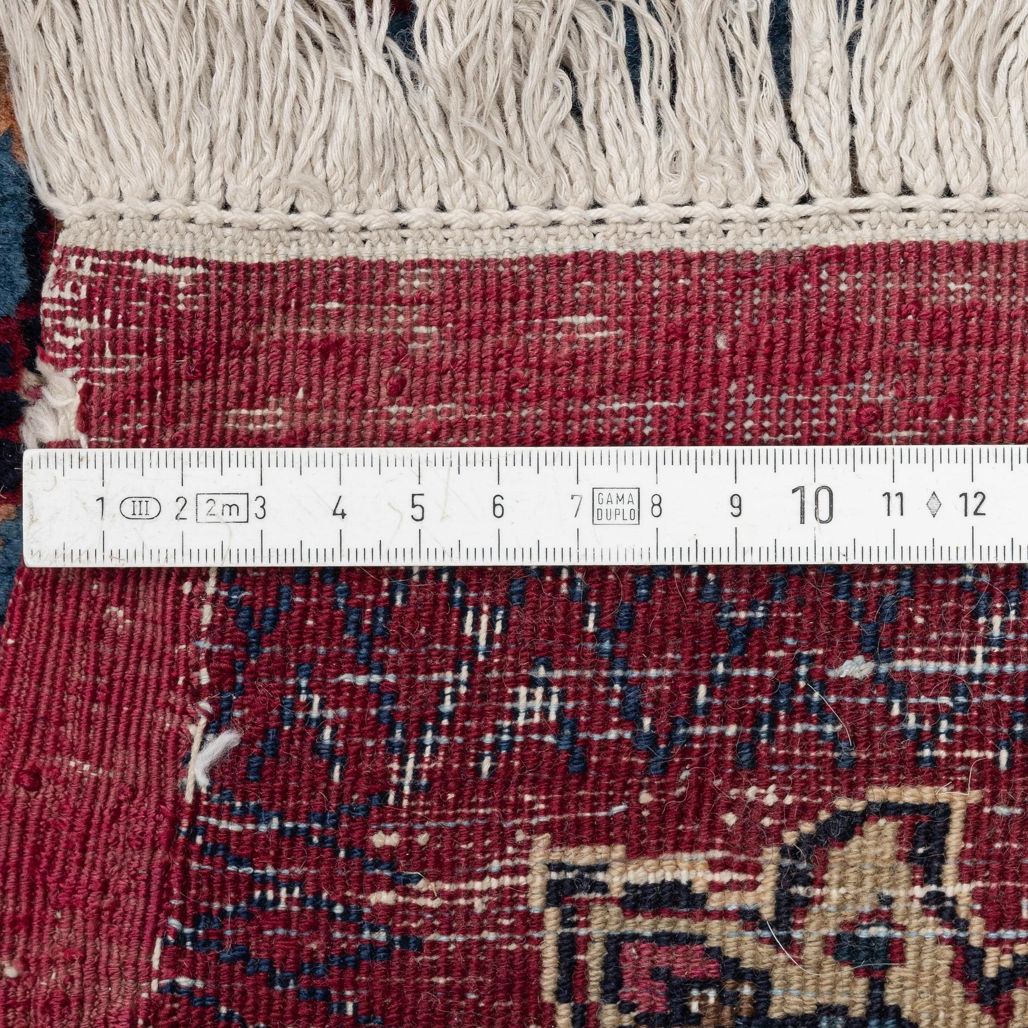 A Mashad carpet, signed Saber, c. 468 x 348 cm.