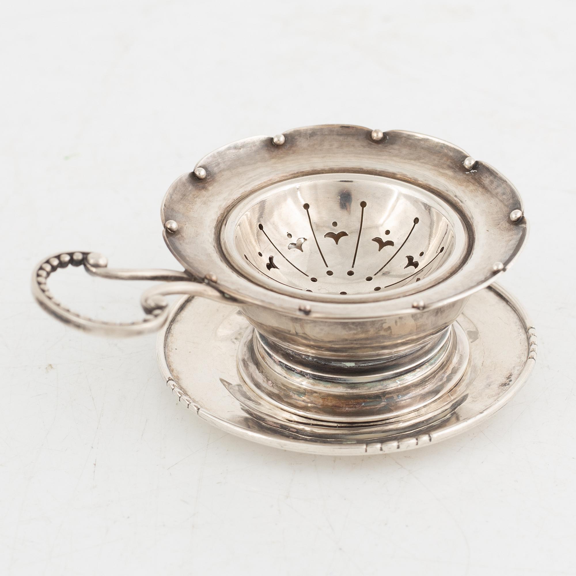 Tea strainer with bowl, sterling silver, Georg Jensen, Copenhagen 1933-1944+tray, silver, Jörgen Jensen, Stockholm 1924.