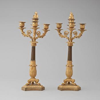 A pair of French Empire early 19th century four-light candelabra.