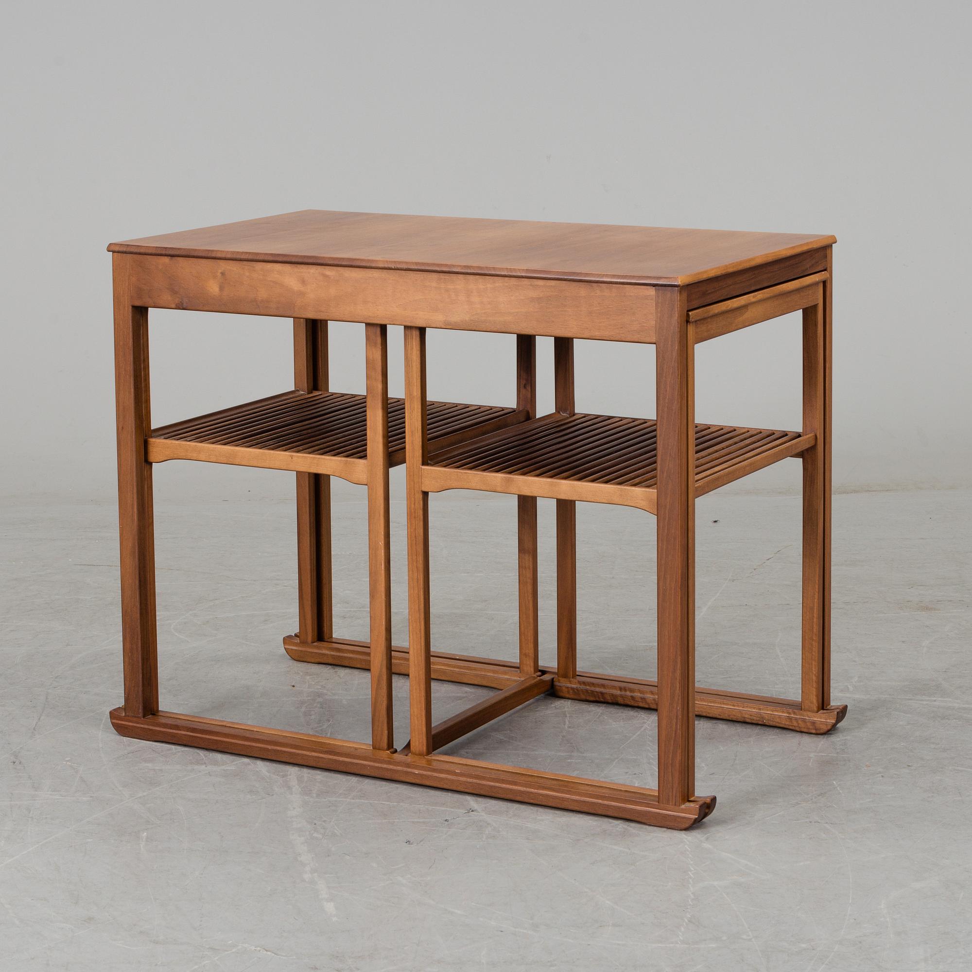 CARL MALMSTEN, a 'Släden' nest of three mahogany tables.