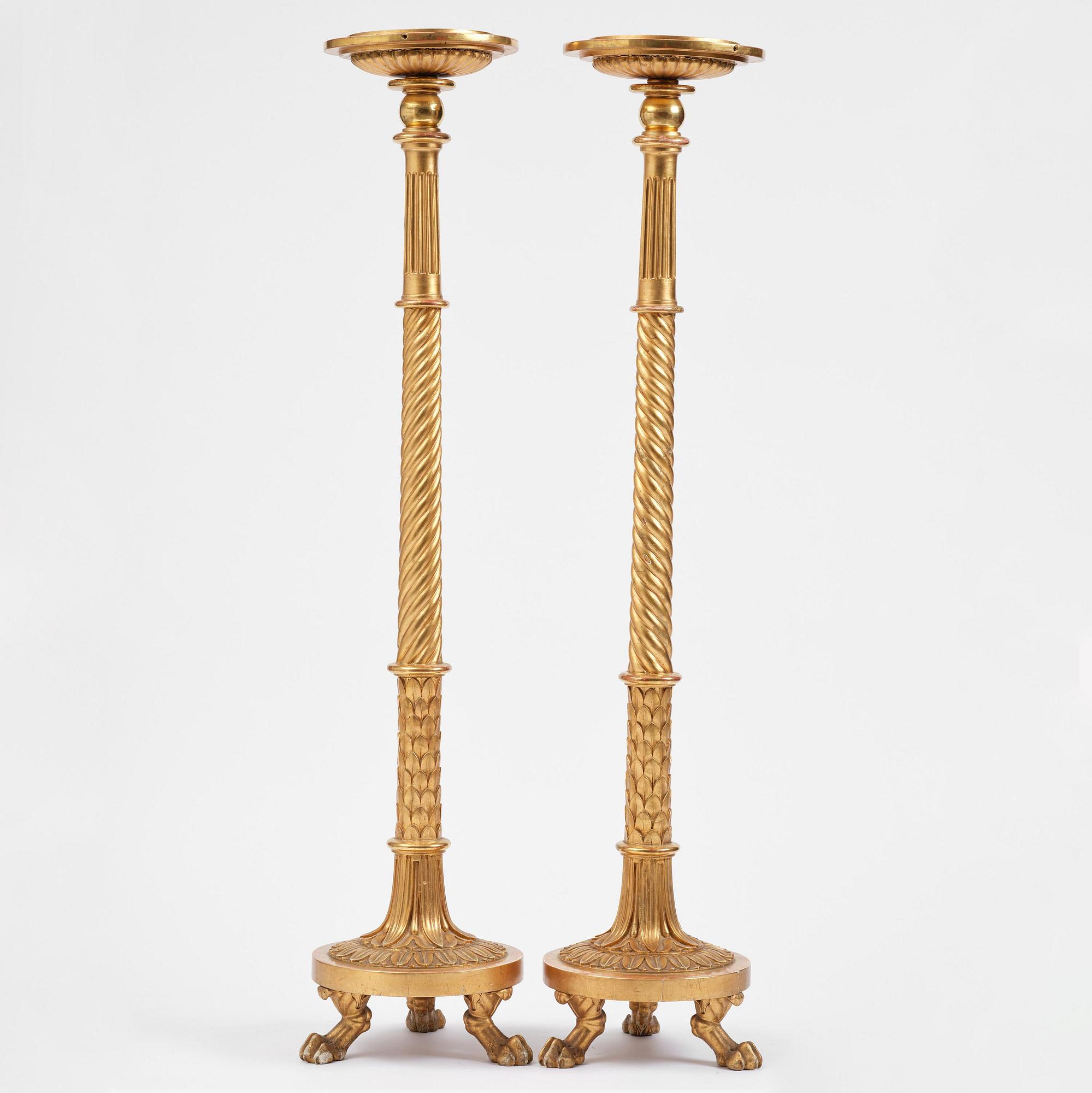 A pair of late Gustavian giltwood torchères by J. Frisk (master in Stockholm 1805-24).