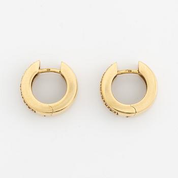 18K gold and brilliant cut diamond hoop earrings.