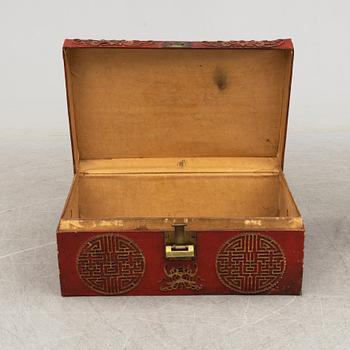 A Chinese red leather and wooden box, 20th century.