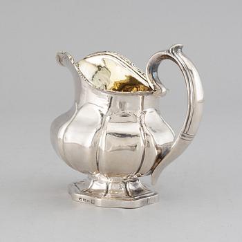 A Russian 19th century parcel-gilt silver cream-jug, mark of Abraham Forstedt, St. Petersburg 1840.