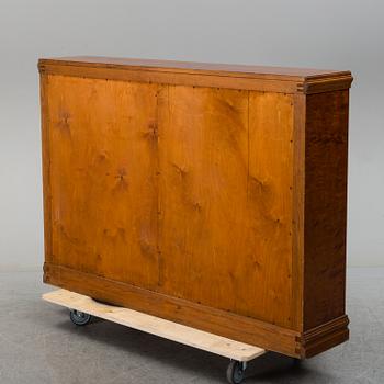 A 1930s birch veneered shelf.