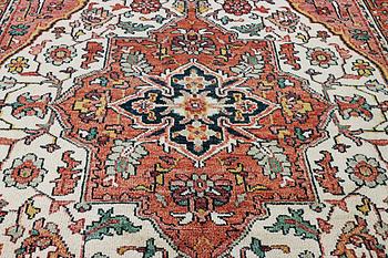 An oriental carpet with Mamluk design, c. 367 x 280 cm.