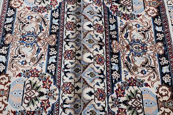 A Nain carpet, part silk, 6 laa, c.303 x 184 cm.