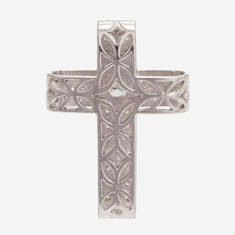 An 18K white gold cross pendant with diamonds.