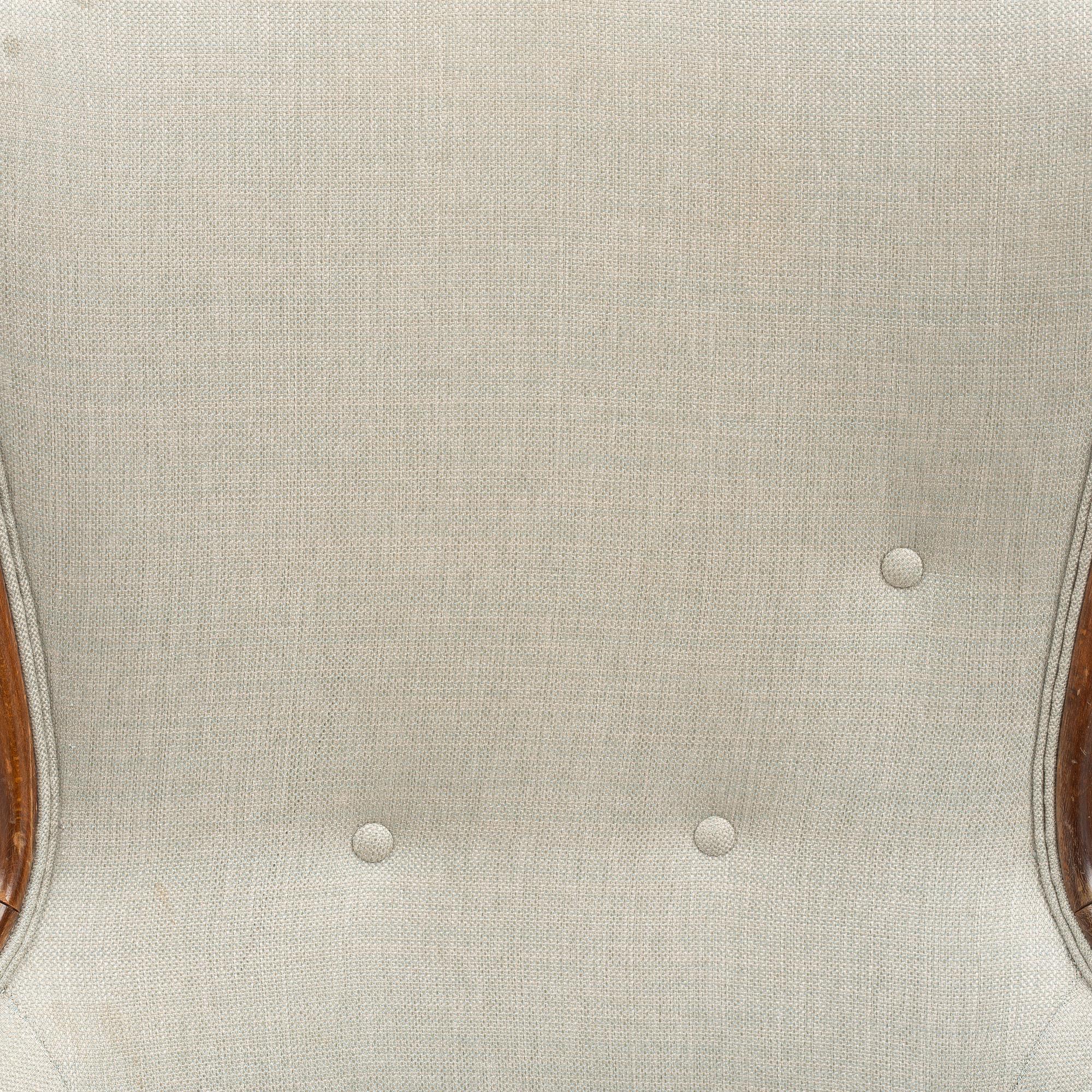 A pair of similar Swedish Modern armchairs, mid 20th century.