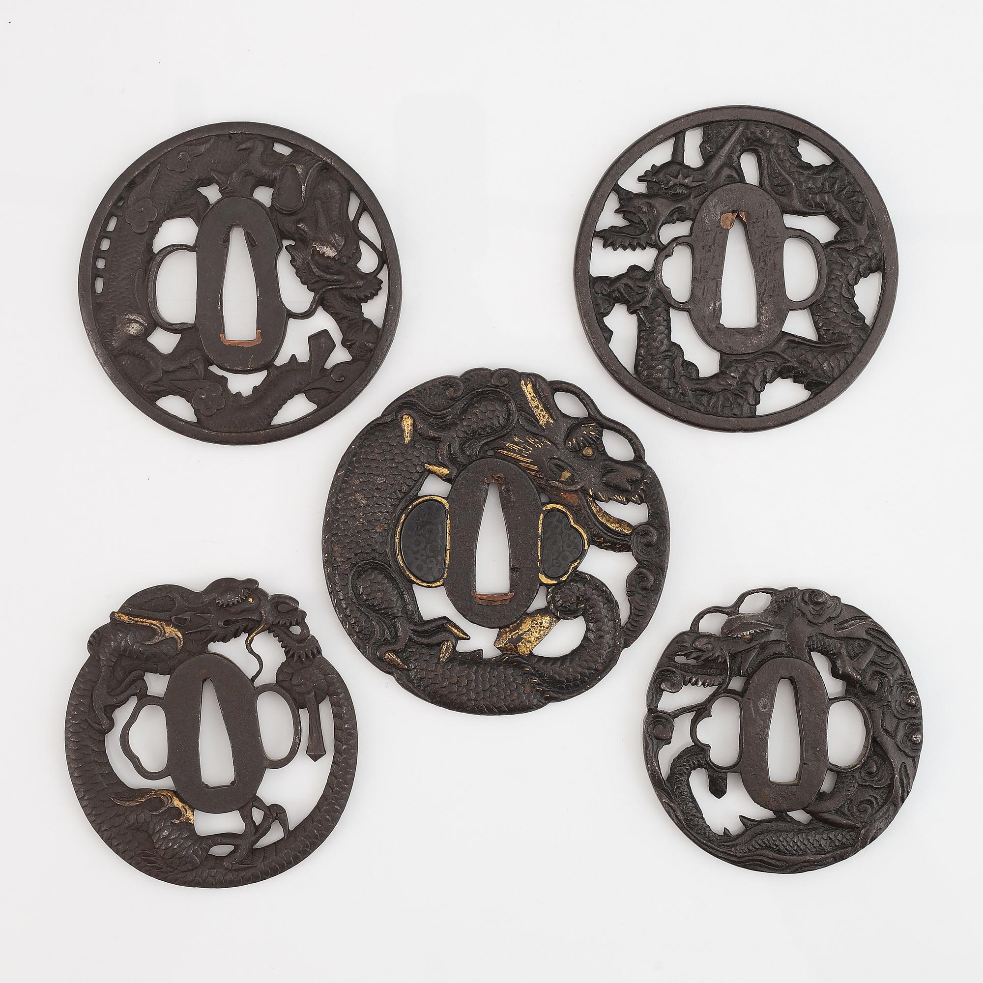 Five iron tsubas with dragon motives, probably 19th Century.