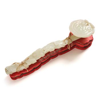 967. A pale celadon ruyi sceptre, Qing dynasty, 19th century.