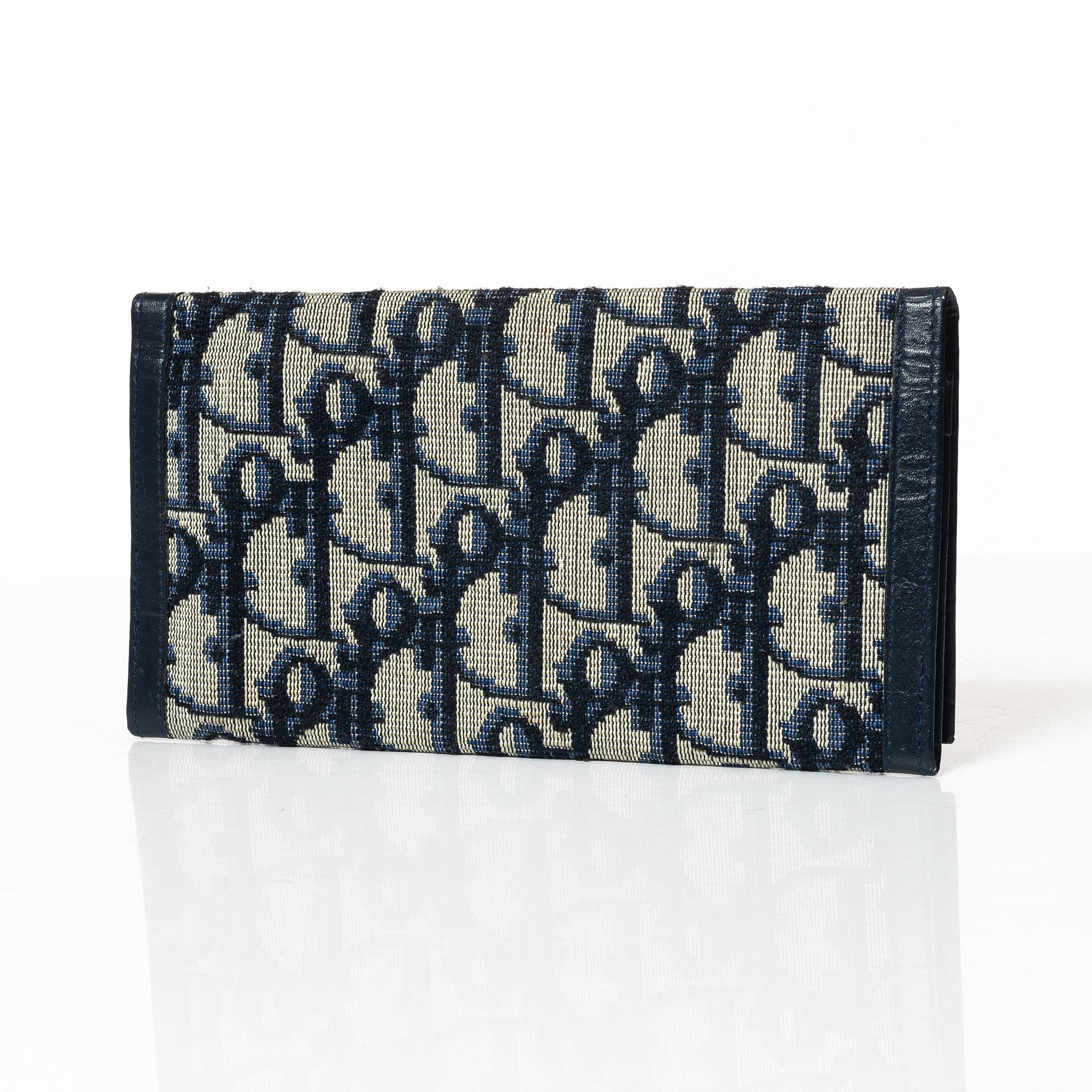Christian Dior, a wallet.