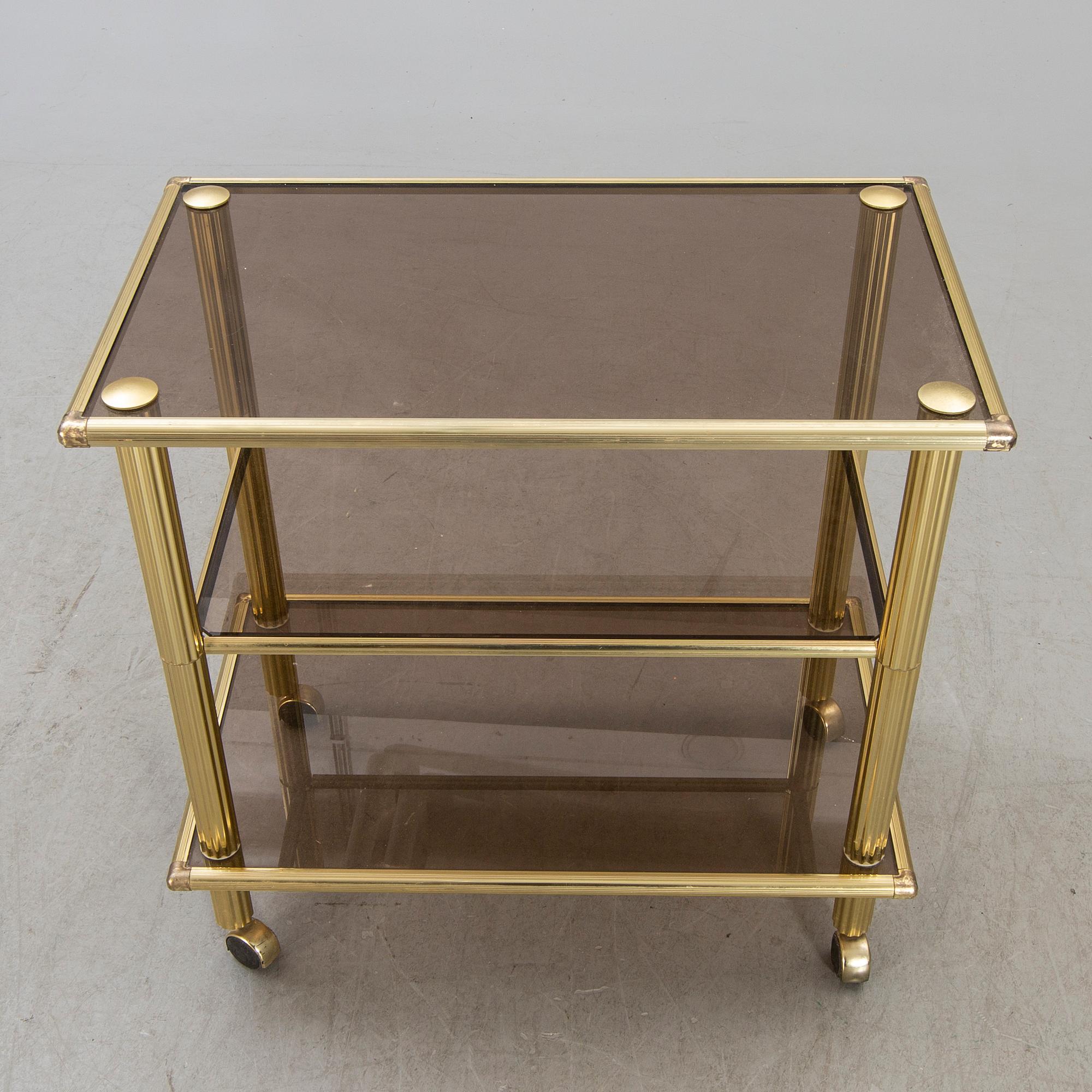A brass serving trolley later part of the 20th century.