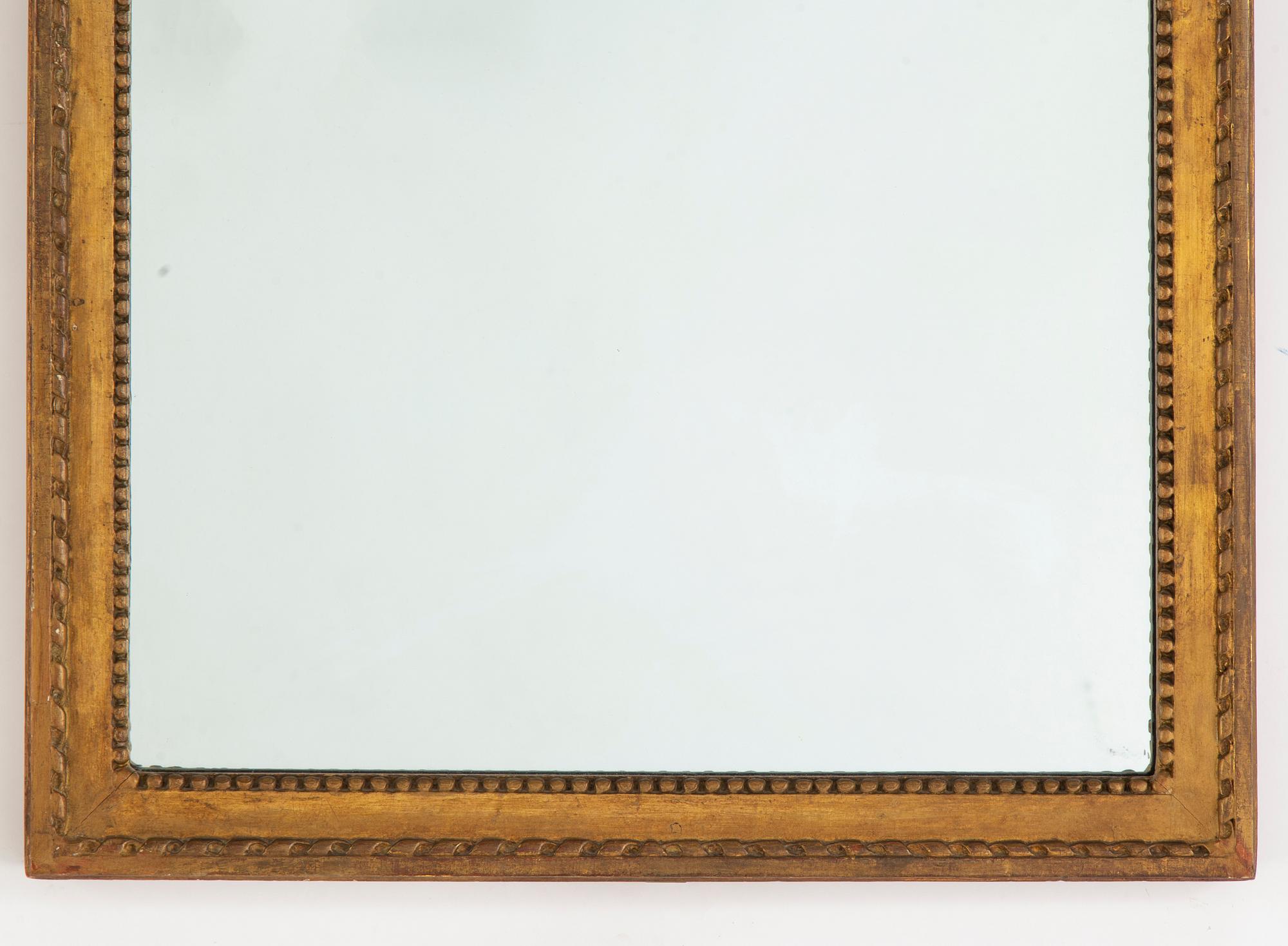 A Gustavian mirror, late 18th century.