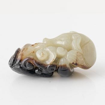 A Chinese nephrite sculpture of a reclining dog, 20th Century.