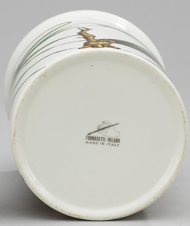 A Fornasetti porcelaine jar with lid.