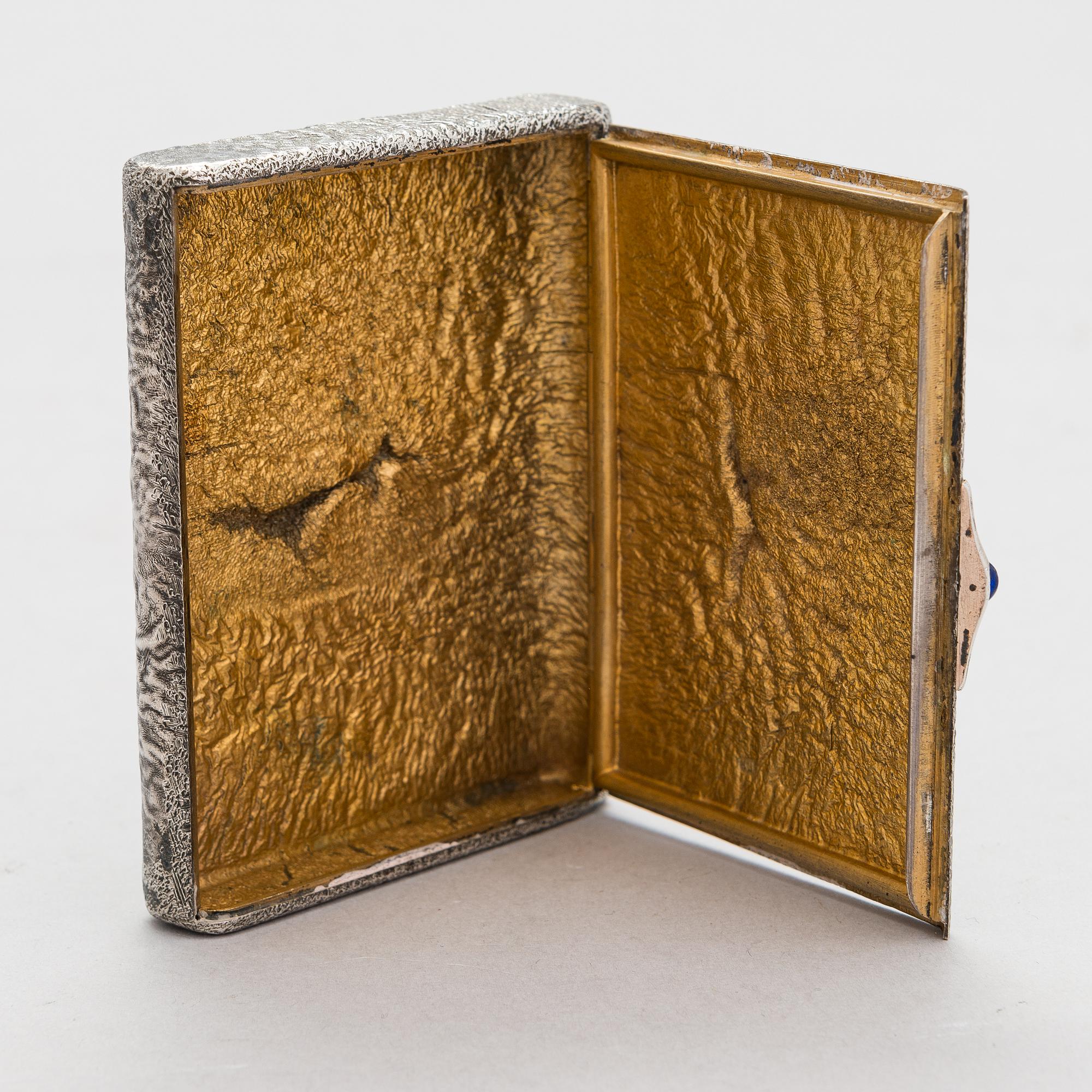 A Russian, early 20th century silver cigarette case, samorodok technique.