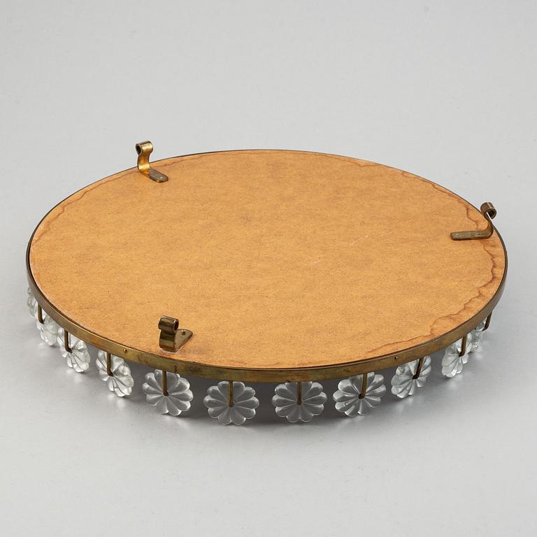 Estrid Ericson,  a mirror and brass table centrepiece from Svenskt Tenn.