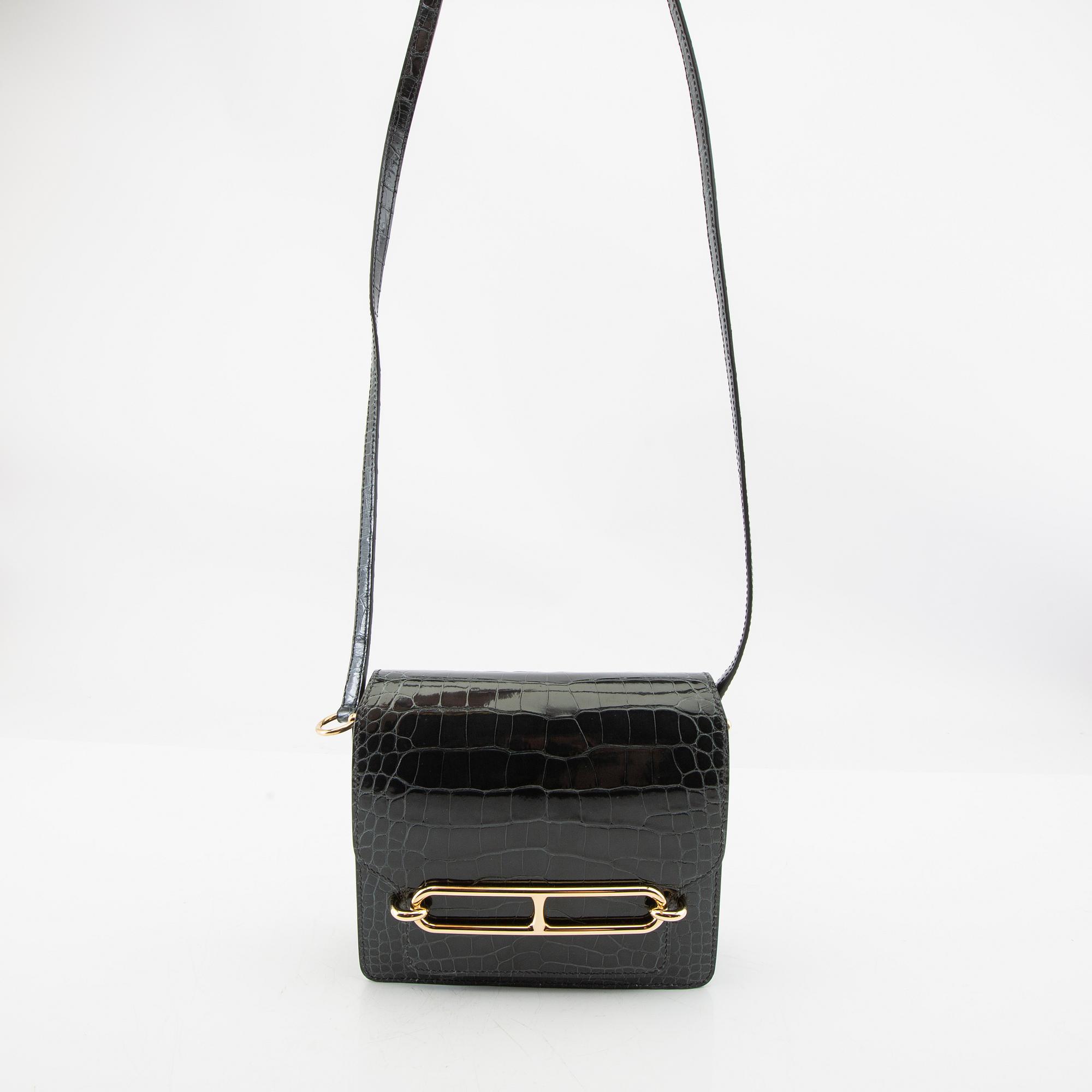 Hermès, bag "Green Shiny Alligator Mini Roulis 18 Permabrass Hardware" 2021.