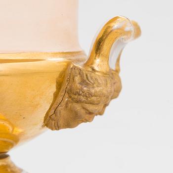 A pair of German porcelain urns from around the mid-19th century.