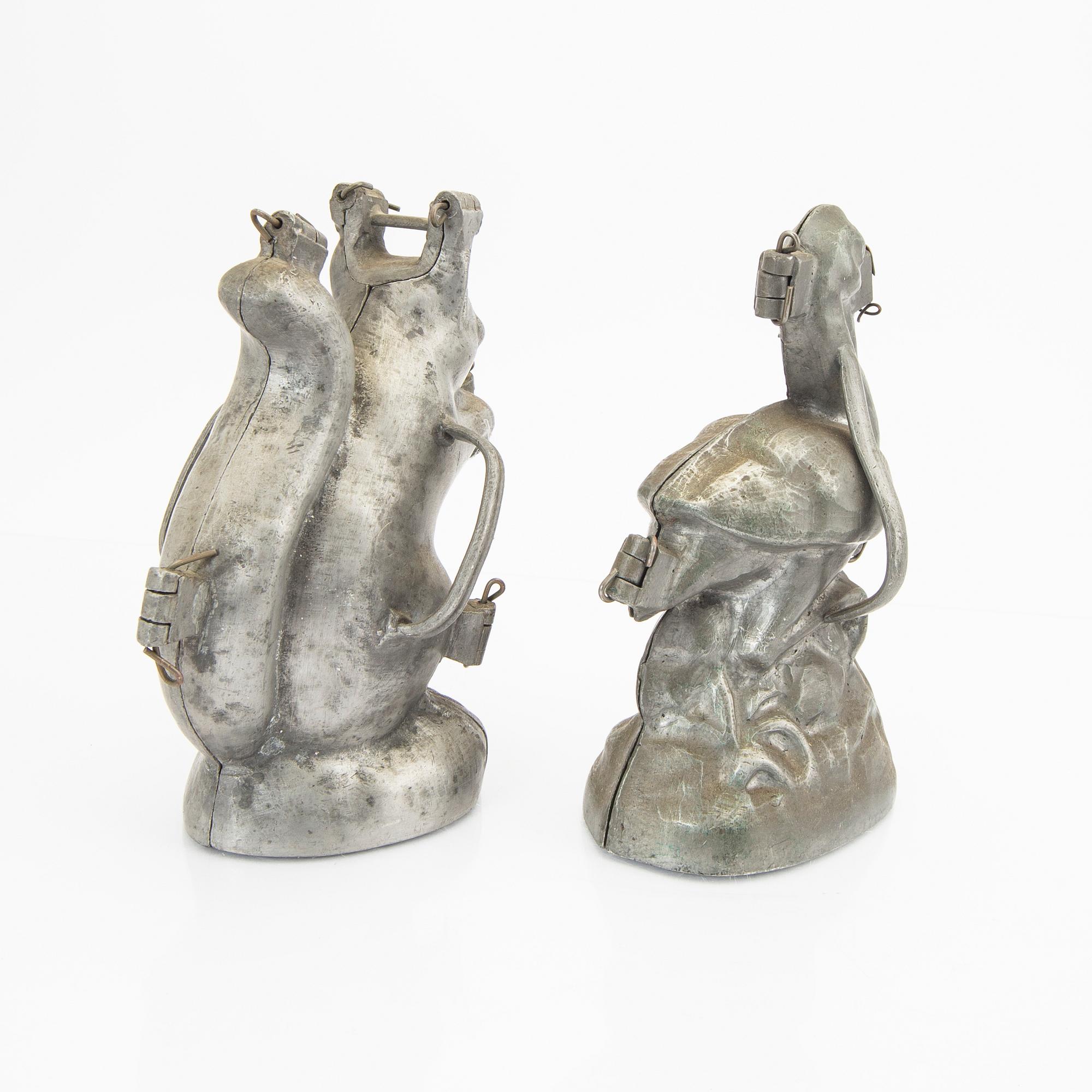 A set of four pewter icecream moulds around 1900.
