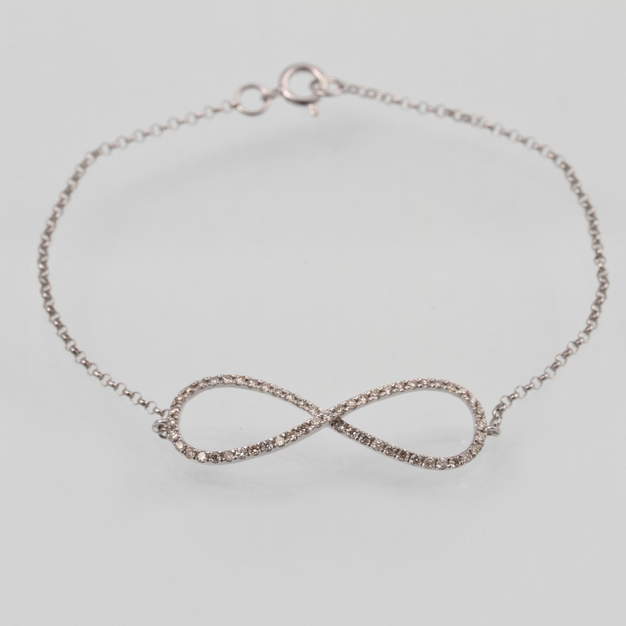 ARMBAND, 18K vitguld med briljantslipade diamanter ca 0.30 ct. Vikt 1,5 gram.