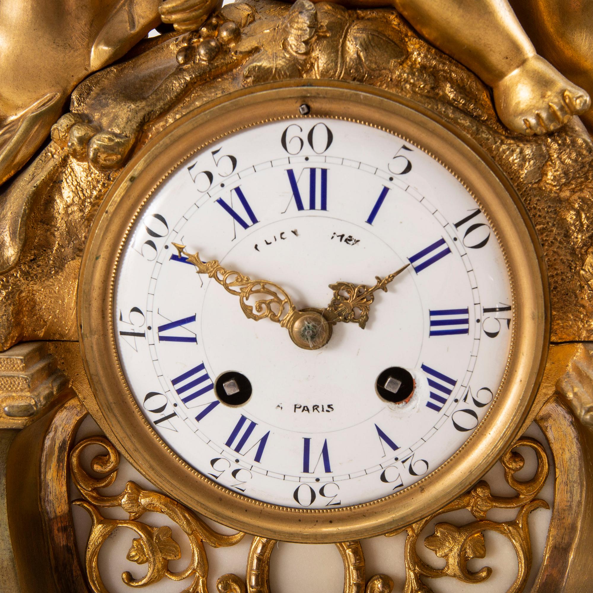 A Louis XV style table clock around 1900.