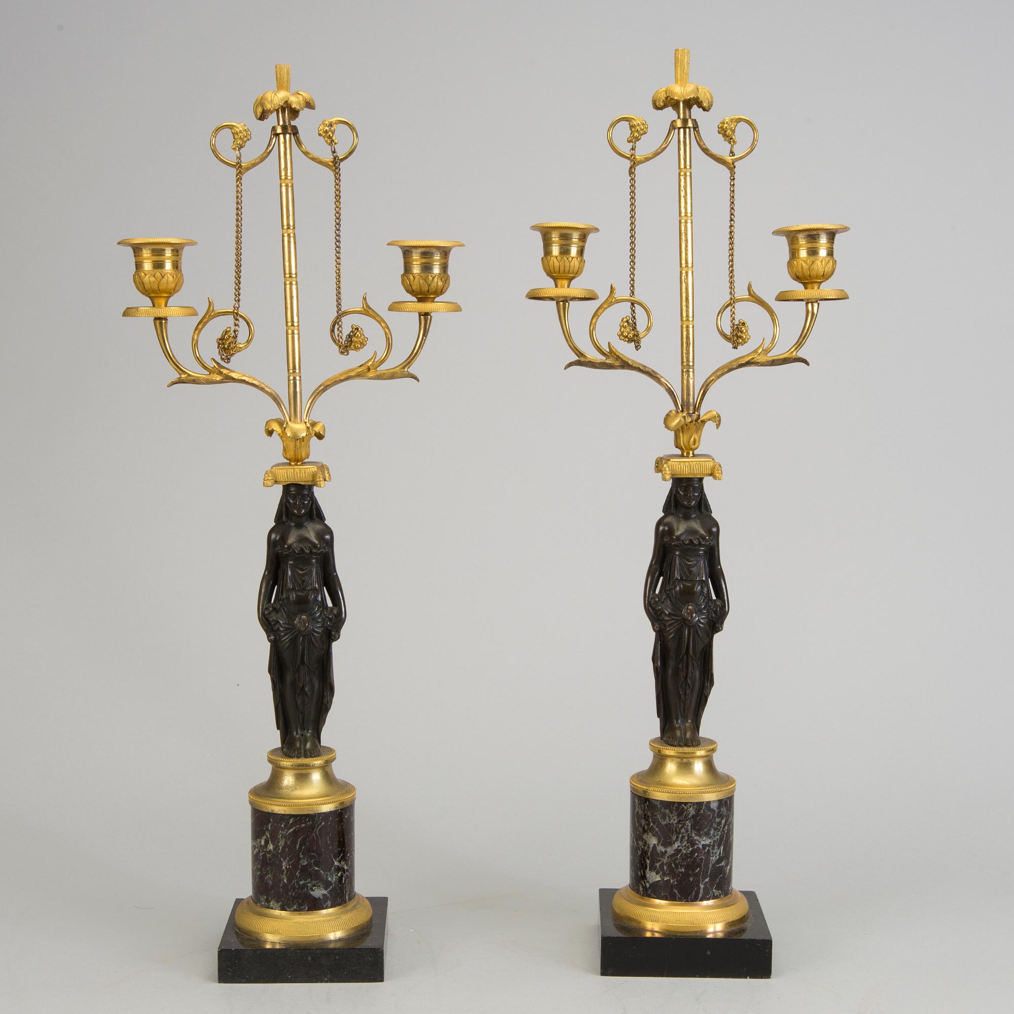 A pair of 1800s empire candelabras.