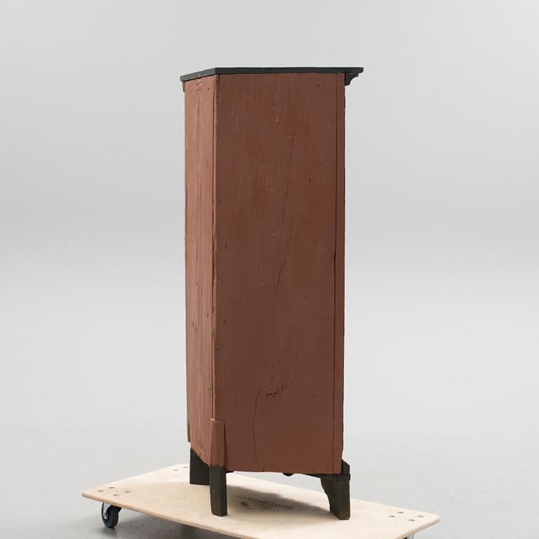 A corner cabinet from the first half of the 19th century.