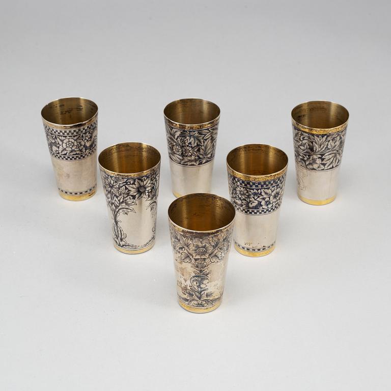 A Russian set of 6 parcel-gilt silver and niello vodka-cups, the Soviet Union/Russia, second half of the 20th century.