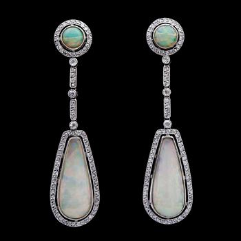 241. A pair of opal, tot. 7.27cts, and diamond earrings, tot. app. 1.90 cts.