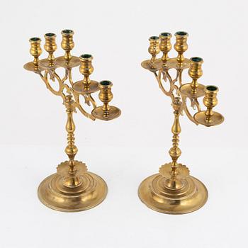 A pair of brass candelabras, early 20th century.