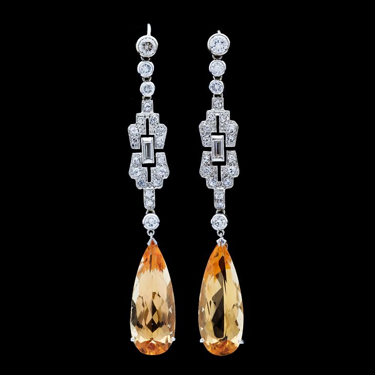 A brilliant- and baguette cut diamond and yellow topaz earrings, Art Deco, later topaz.