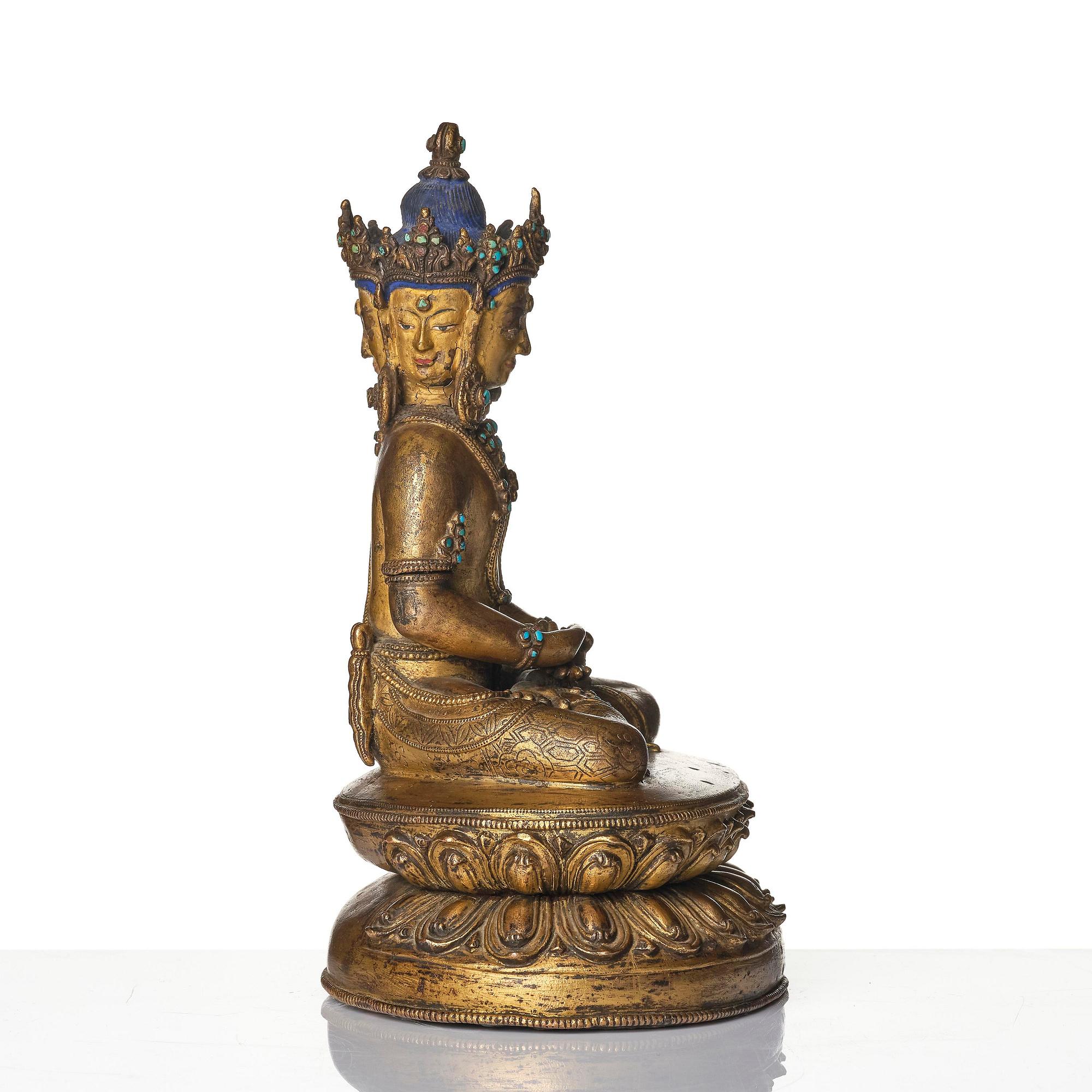 A Tibetan or Nepalese Gilt-Copper Alloy Figure of Sarvavid Vairocana, 15th century.