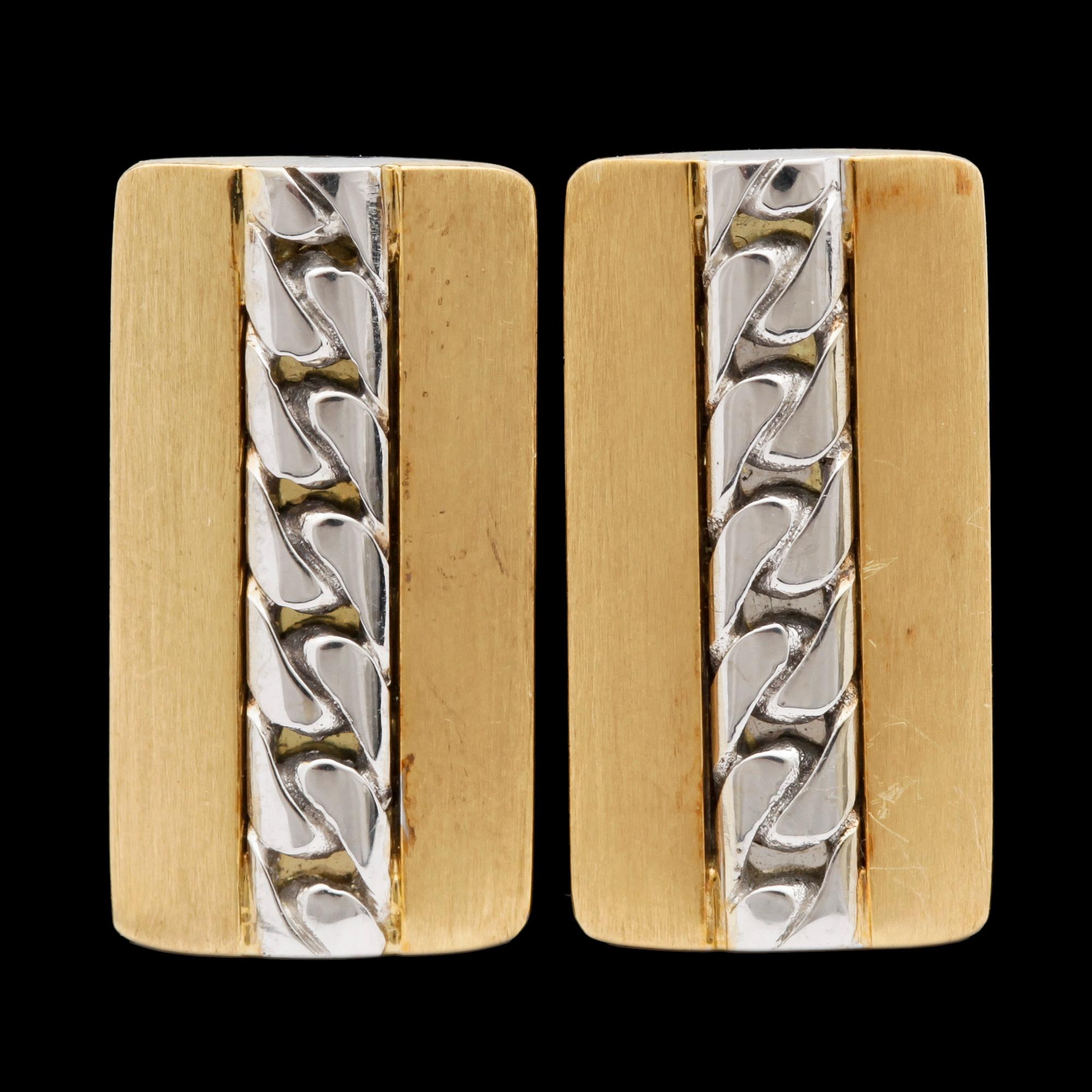A pair of gold cufflinks.