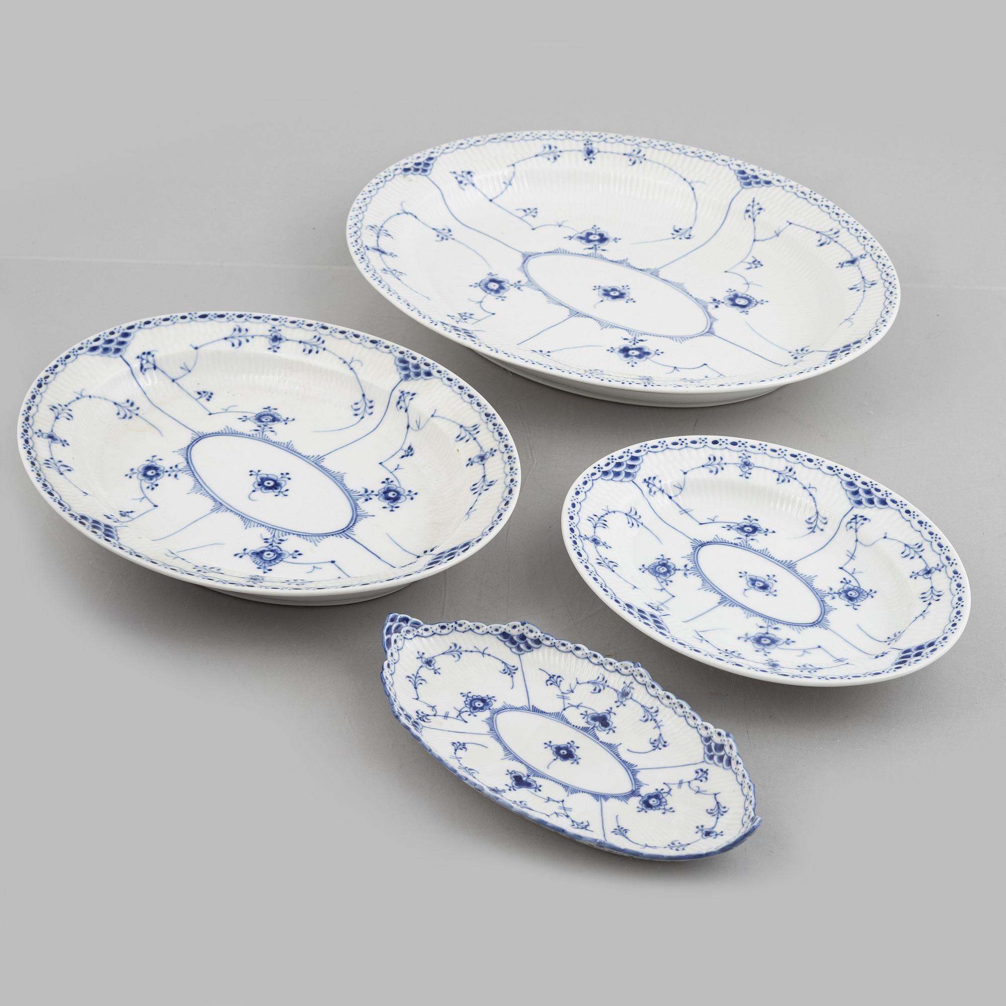 Royal Copenhagen, a 116-piece 'blue Fluted' porcelain dinner and coffee service, half lace, Denmark, mostly 1923-34.
