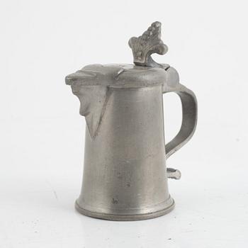 A pewter measuring cup by an unidentified master, dated 1766.