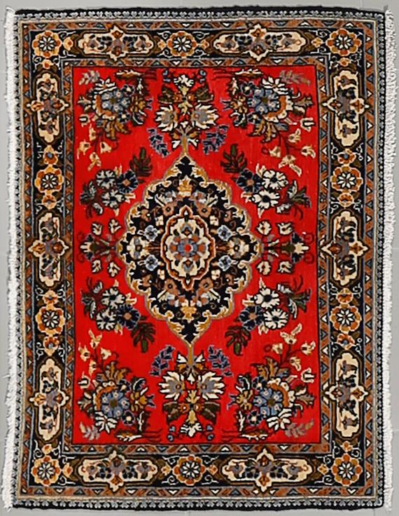 A GHOM RUG, 81 x 59 cm.